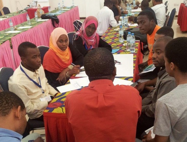 Breakout groups discussing the enabling and hindering forces impacting their work in Zanzibar